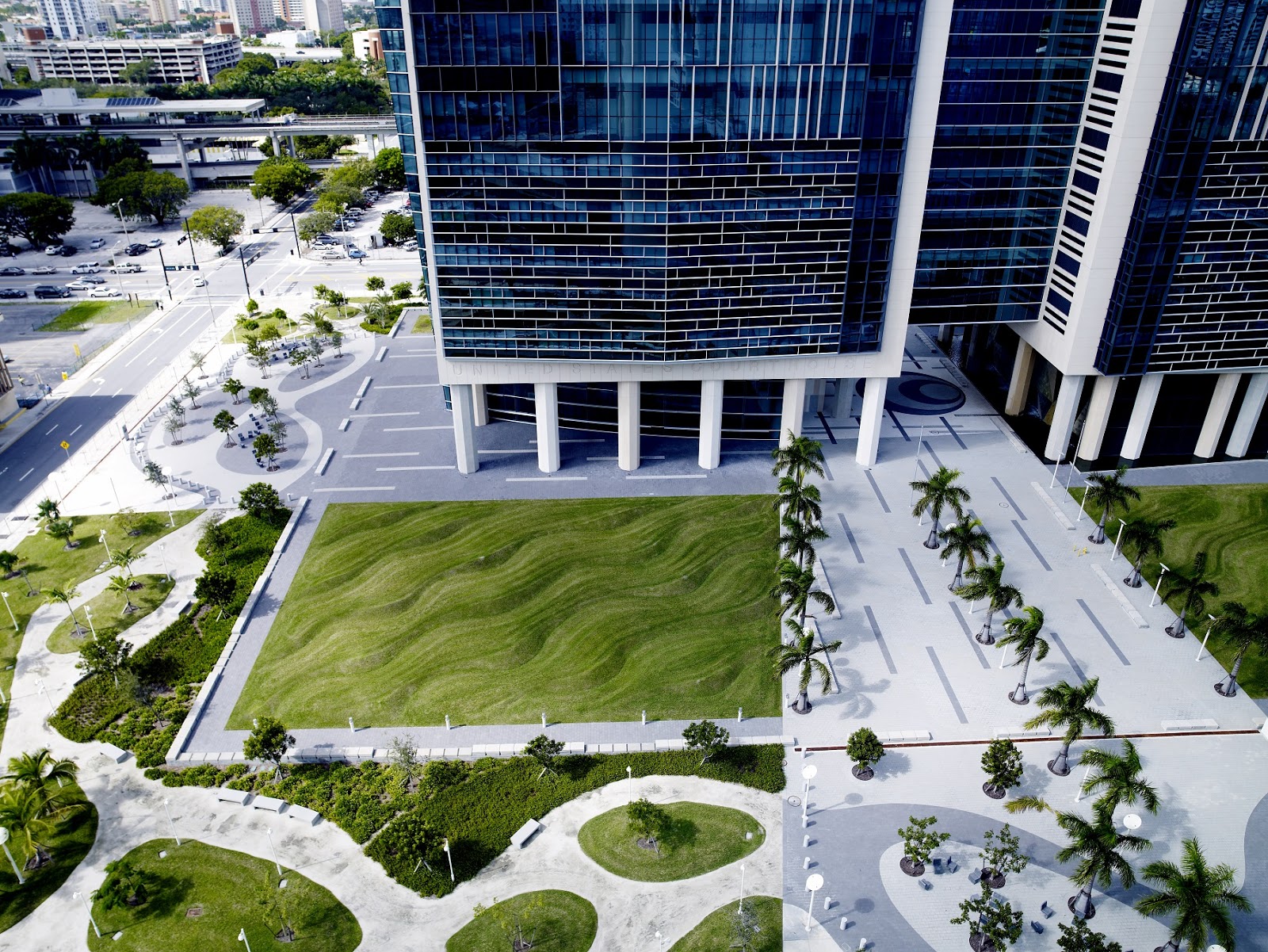An aerial view of Flutter, by Maya Lin, showing a pair of sculpted lawns that mimic rippling water or sand.