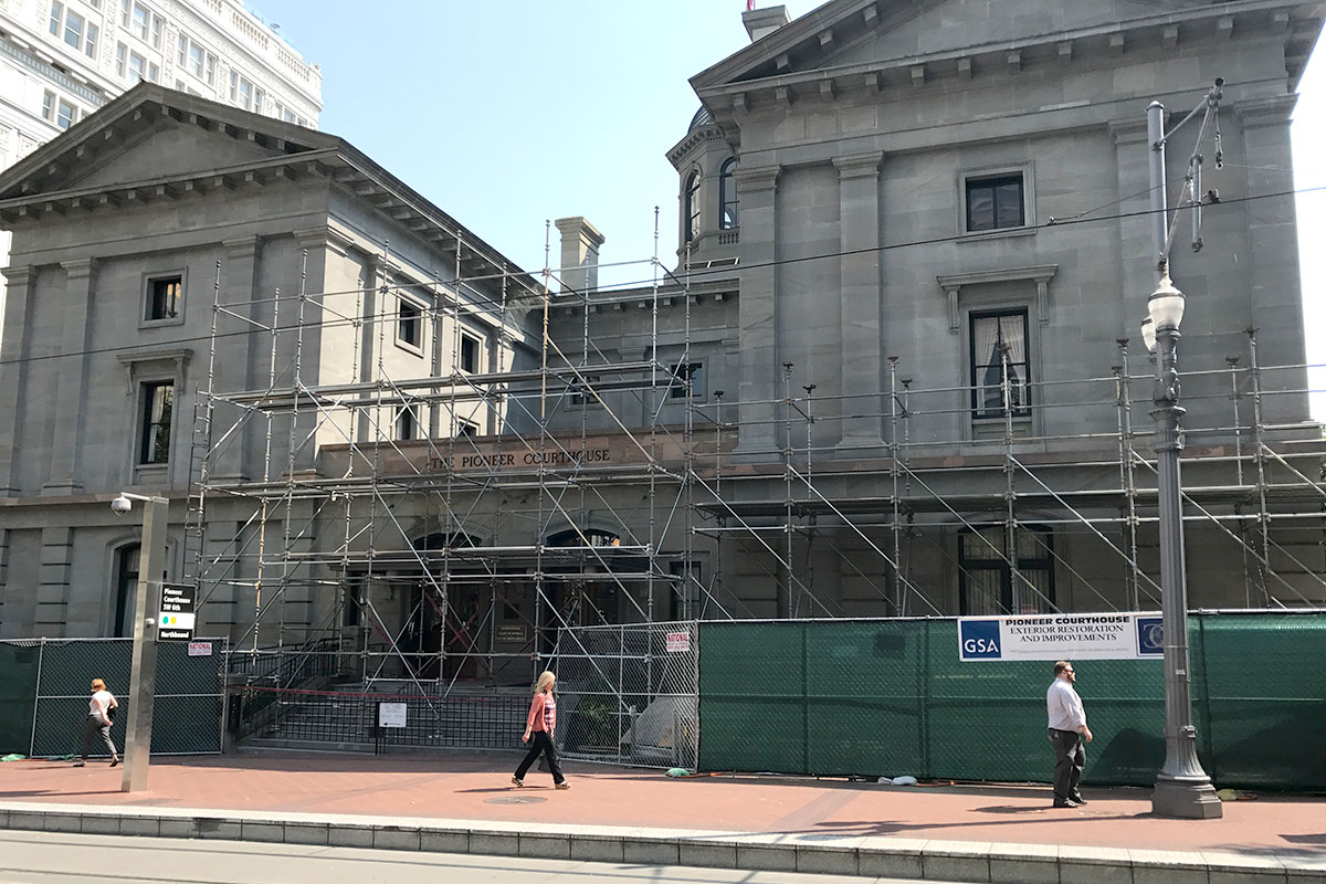 Pioneer Courthouse, Portland, OR, with exterior scaffolding and construction fencing partially around the building