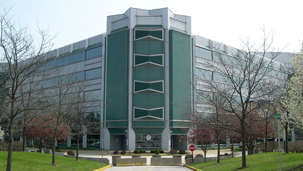 A 5-story building with a green front