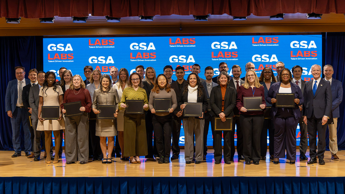 Inaugural class of 25 employees pose for a group photo with Administrator Ed Forst (far right).