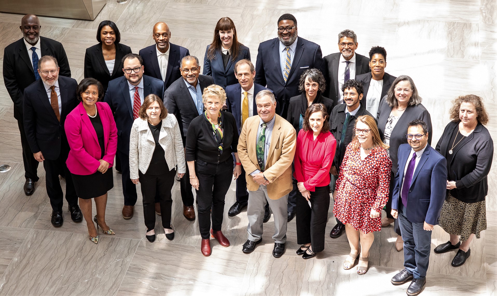 A group of people standing around GSA Administrator Robin Carnahan