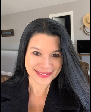 A smiling woman with long dark hair. 