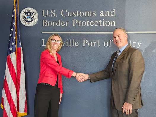 GSAs Diana Schlumpf shaking hands with CBP officer