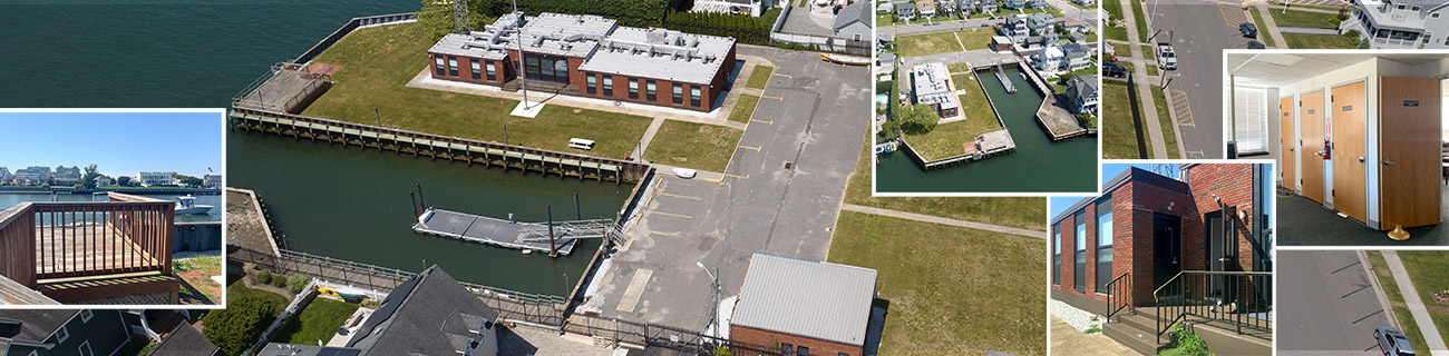  Aerial and building views of a lot with red brick buildings near water, with parking lot, green areas, and docks.