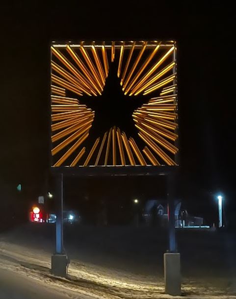 night time image of artwork, Stella., at the Madawaska LPOE