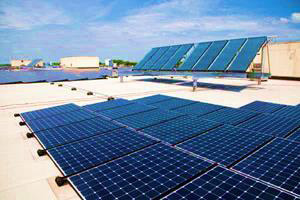 Medium shot of solar panels on rooftop
