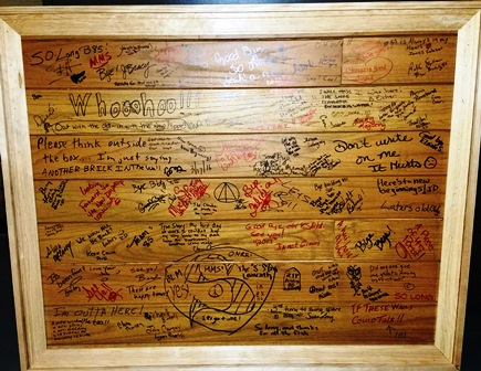 Image of framed office wall with employee handwritten messages