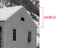 exterior. Side of building showing the gable, the triangular area from the roof to the bottom of the eaves.