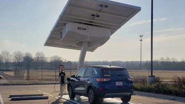 VA vehicle being charged through a solar-powered charger at the VA Medical Center in Topeka, Kans