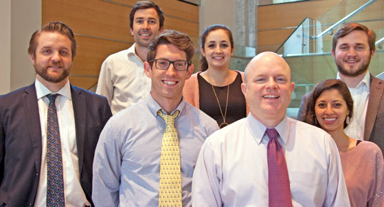 GSA at 70: Mission Support, seven smiling people from the GSA Office of Evidence and Analysis