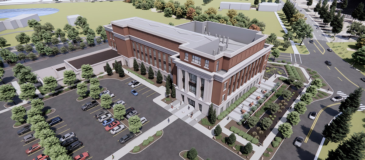 Aerial view of a rendering of a red brick, rectangular, multi-story building, with parking lot and greenery around it