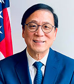 Portrait of a smiling Asian man with short black hair