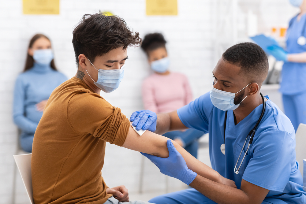 Doctor administering a vaccine