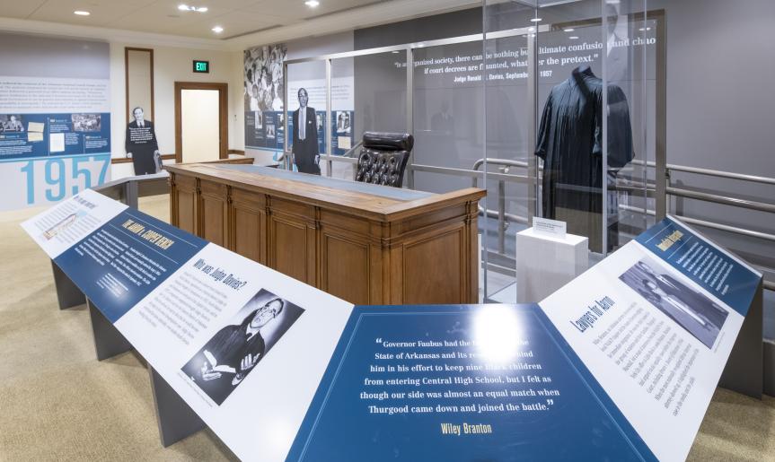 The Cooper bench and a judge&#039;s robe on display at the Supreme Court Exhibition.