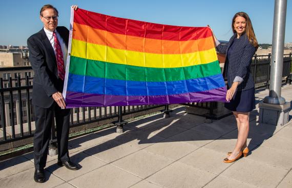 Acting Administrator Katy Kale with Pride flag