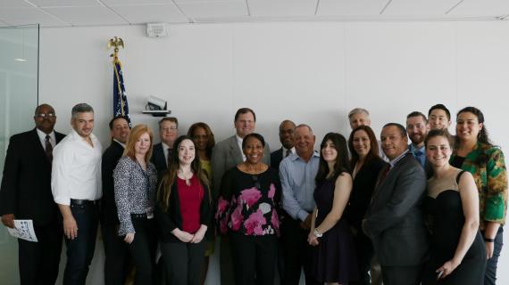Regional Administrator John A. Sarcone III and Director of the Regional Office of Small Business Utilization Janice Bracey (both center) pose for a photo with Service-Disabled Veteran-Owned small business owners. The firm principals, along with Region 2 acquisitions staff and employees in the regional OSBU attended the briefing May 3 to discuss ways GSA can make it easier to do business with the federal government. (Photo by Amanda Smith)