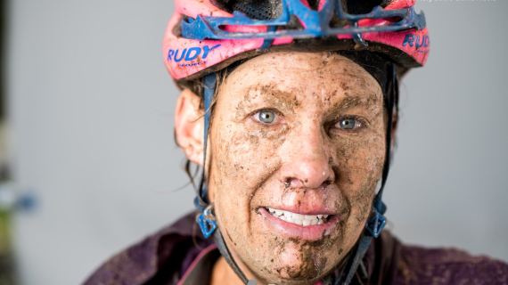 R8 Kristi Leinen with bicycle helmet and mud