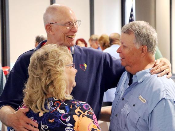 GSA Retiree James Ogden visits with former regional PBS employees Marcia Green and John Casey at the Heartland Region's reunion.