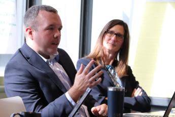  Aletha Pelham (GSA FAS) looks on as Alex Wrisinger (GSA FAS) provides an update