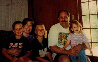 Santella poses for a photo with his wife Charlotte and their kids Nicholas, Frank & Christine in 1999. 