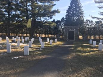 dozens of white gravestones