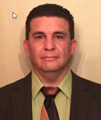 Man with short dark hair in shirt