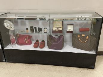 Display case with various counterfeit merchandise captured at the JFK International Airport in Queens, New York.