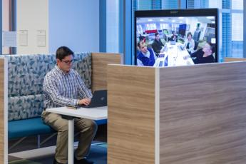 A federal employee collaborates with colleagues from GSA’s Workplace Innovation Lab