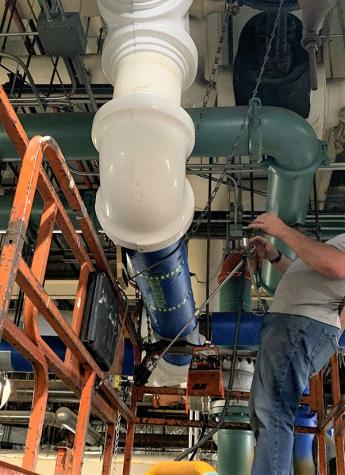 a man taking a picture of the pipe