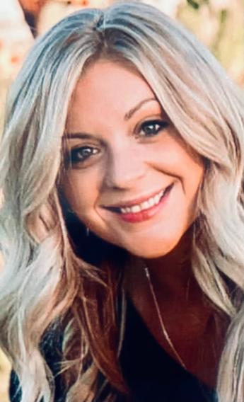 Megan Knight. Light complexion with long blond hair, smiling.