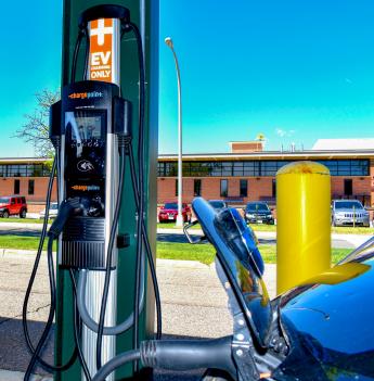 Car charging at electric vehicle charging station