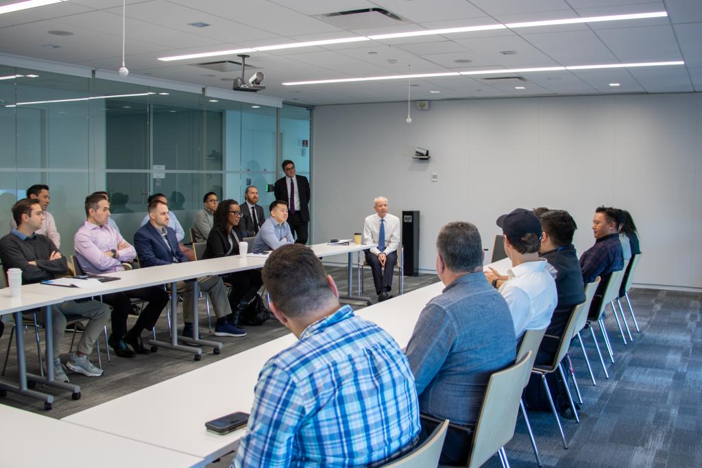 Administrator Forst chats in a conference room in New York