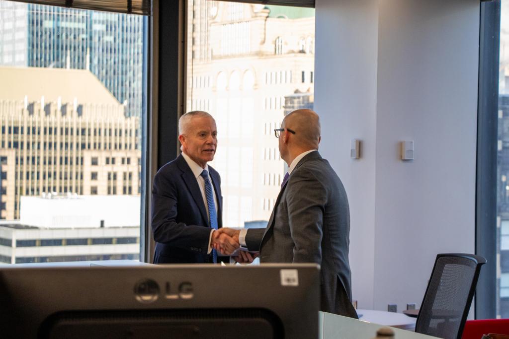 Administrator Forst shaking hands with an employee in Chicago