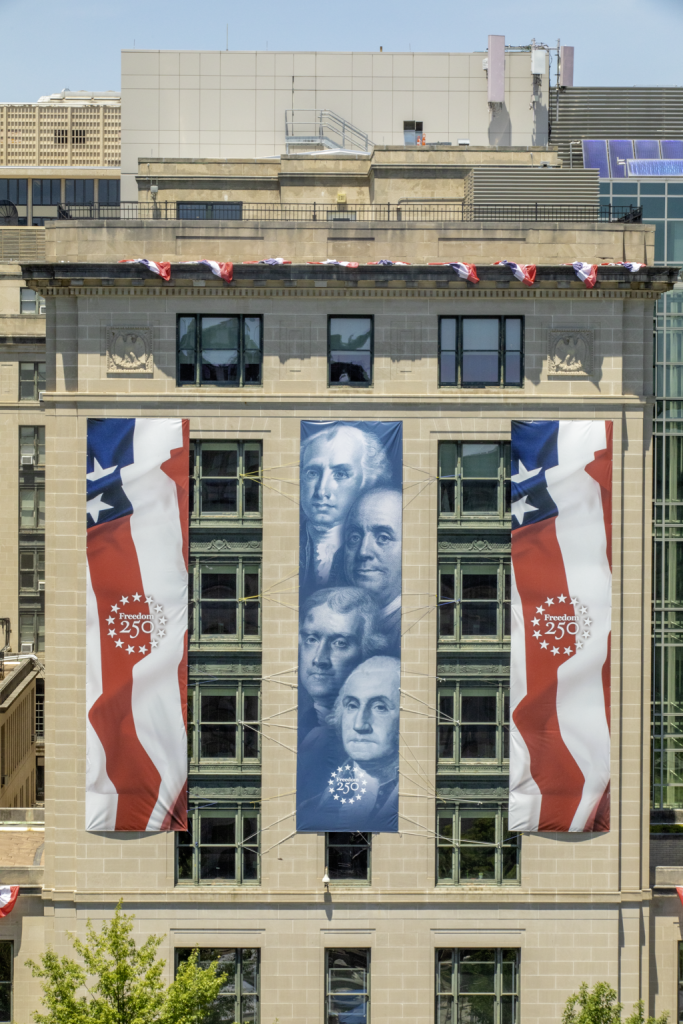 The GSA headquarters building exterior is decorated to honor and celebrate the nation's 250th birthday.