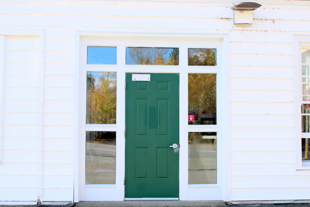 A white building with a green door