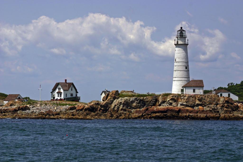 A lighthouse with the ocean in the background