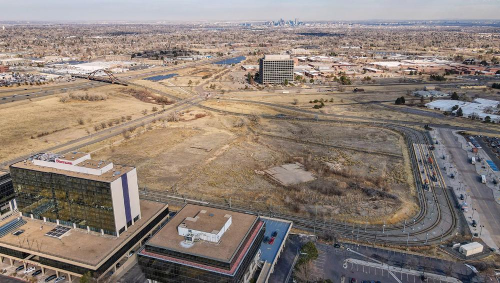7 Looking east Union Blvd businesses in the foreground. a view of the Property the Denver Federal Center to the east of the Prop