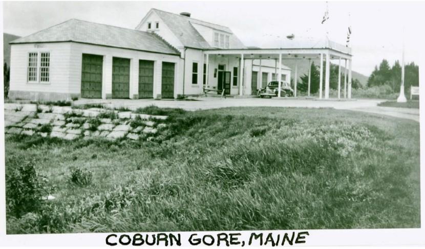 old black and white photo of the port with a 1950s black car under the car port