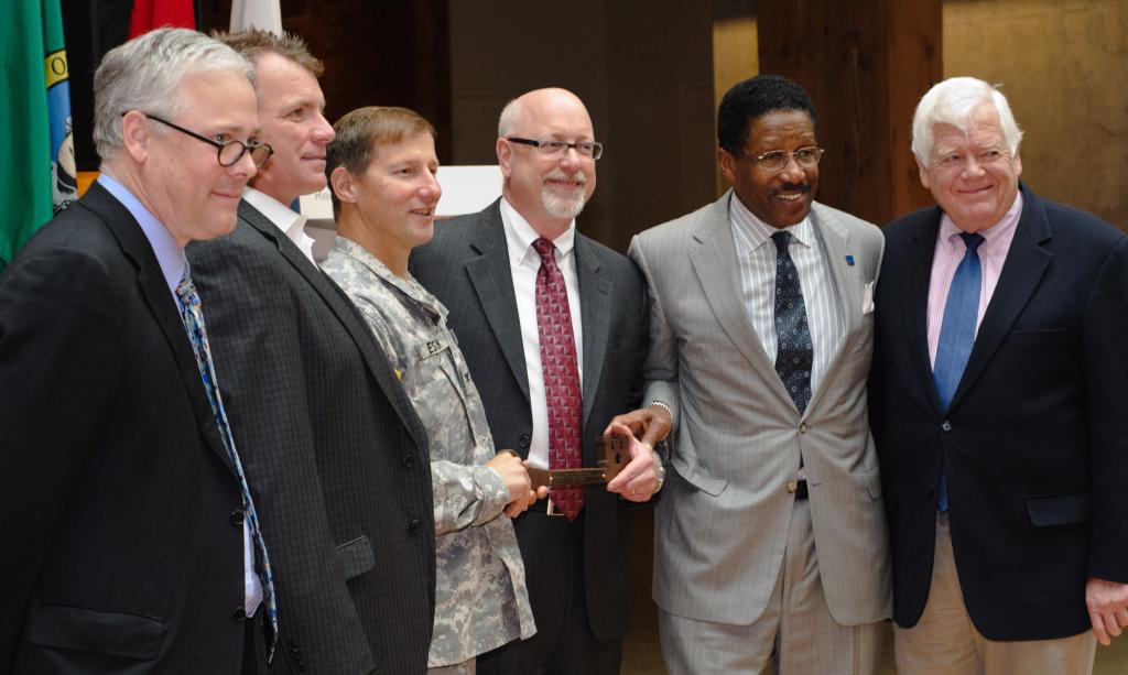 GSA, Sellen, ZGF, and the USACE Celebrate the Building Dedication with the handing over of the "Key" to building... the "Key" was made with some of the reclaimed timber from the original building.