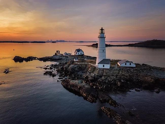 Lighthouse with a sunset behind it 