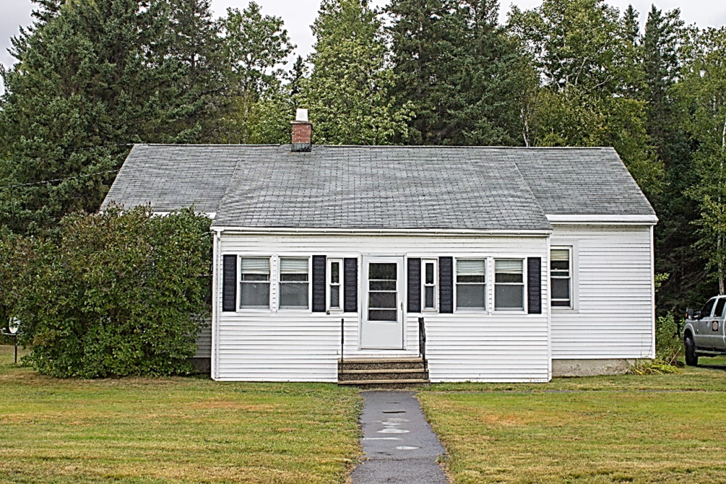 white one story home viewed from the front