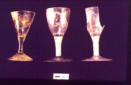 The Hoffman Assemblage 18th century wine glasses, one pattern molded (left) and two with air twist stems (right)