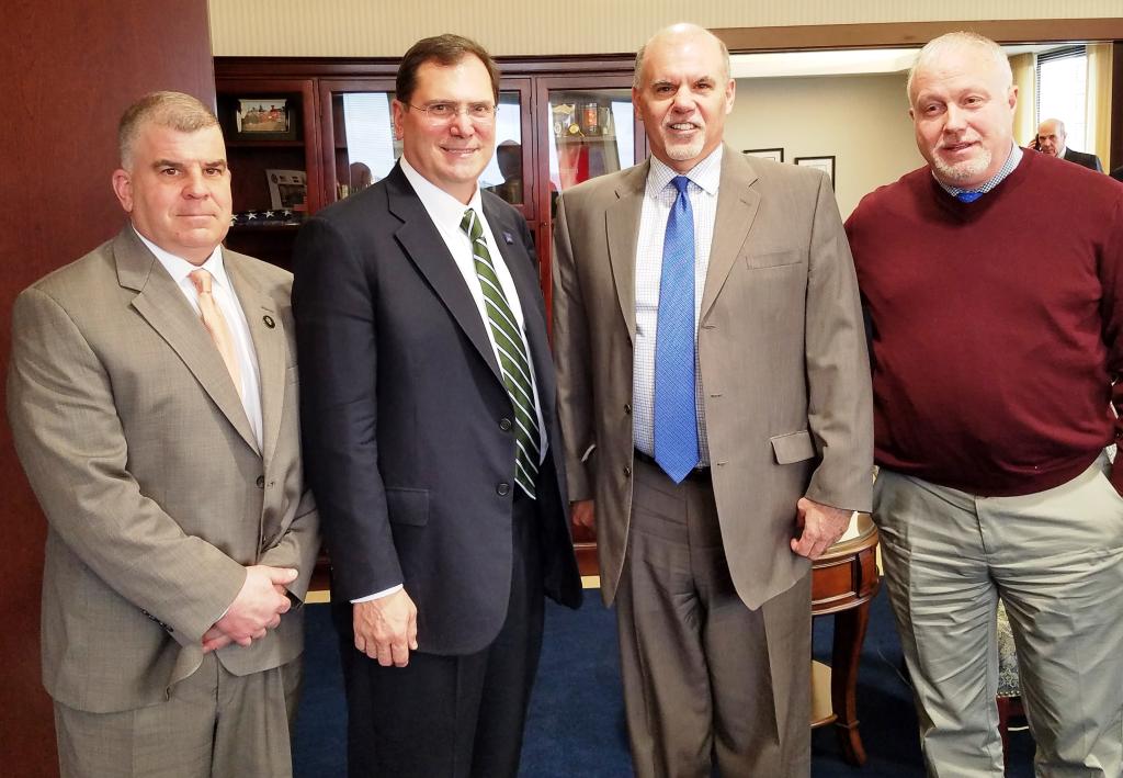 Regional Administrator John A. Sarcone III (second from left) poses for a photo with Deputy Clerk John Domurad, Chief Judge Glen