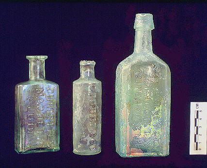 Irish Tenement and Saloon embossed medicinal bottles