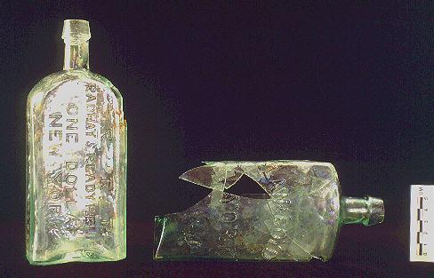 Irish Tenement and Saloon embossed patent medicine bottles