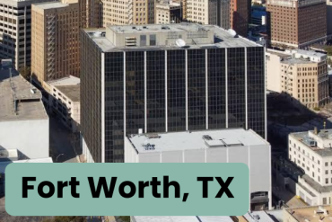 A picture of the Fritz Lanham Federal Building with the text "Fort Worth, TX" in a green bubble in the lower left hand corner of the image.