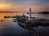 Lighthouse with a sunset behind it 