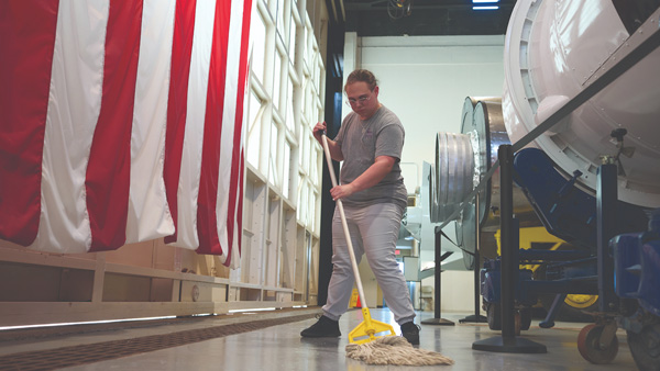  Woman mopping floor in a federal facility